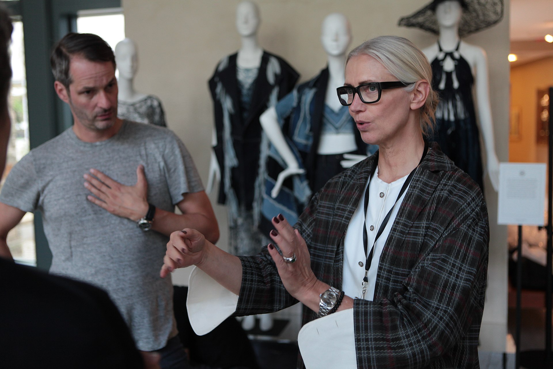 stylists-talking-with-gowns-at-the-background