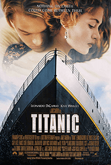 a man and a woman hugging over a picture of the Titanic's bow
