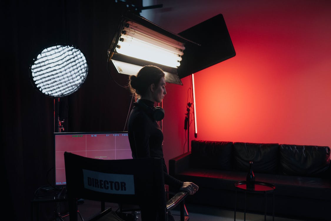 a female director standing in front of her director’s chair